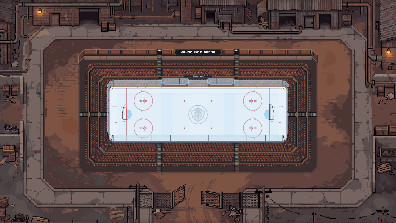 An industrial arena with brown flooring and heavy metal walls.