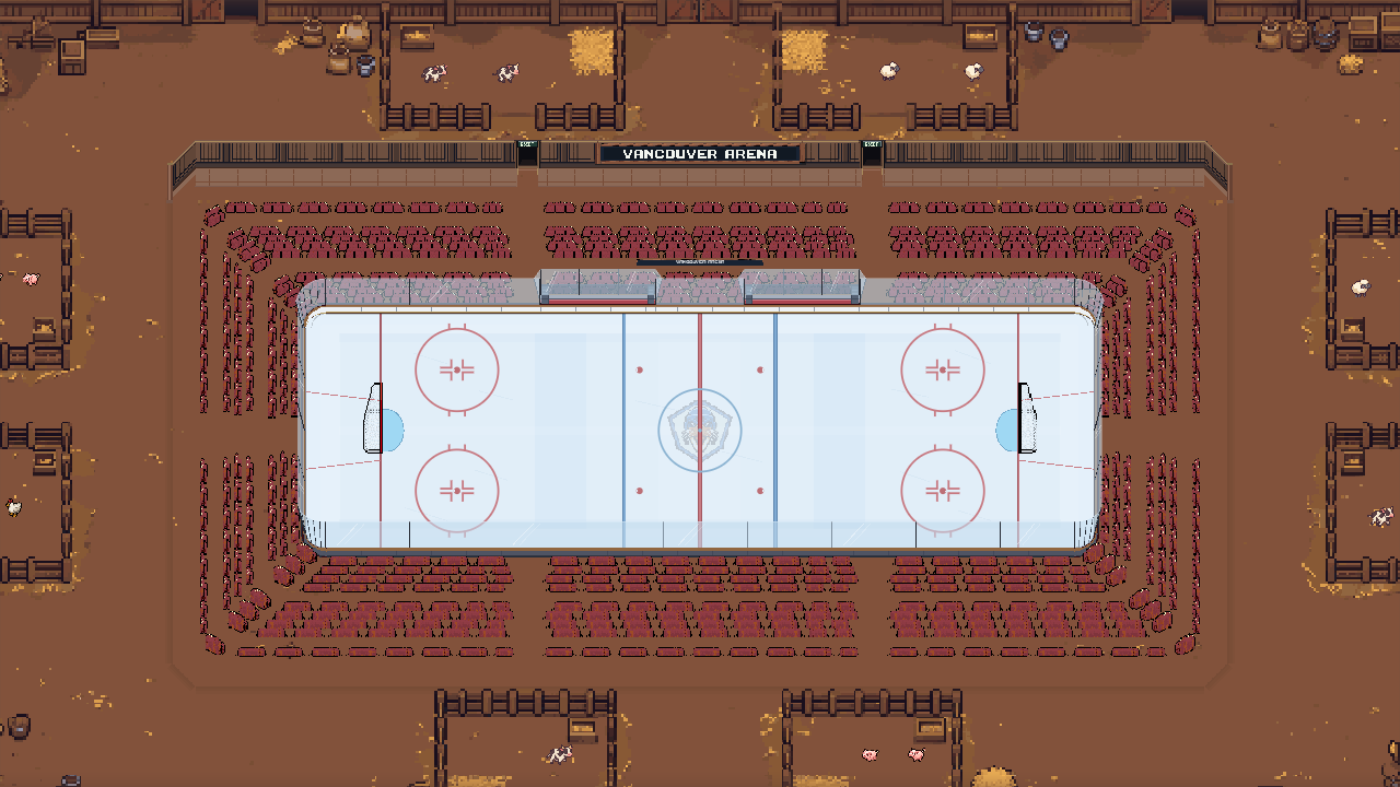A rink inside a timber barn with hay bales lining the spectator areas.
